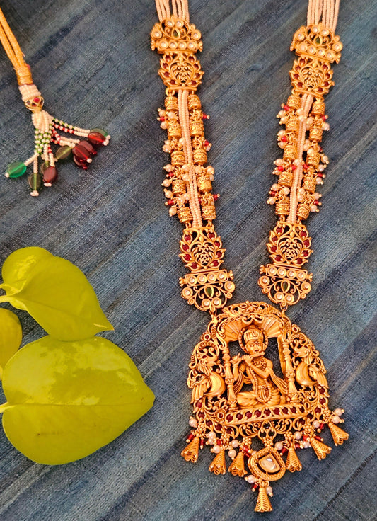 Temple jewelry set in matt gold finish necklace with krishna pendant with intricate carving, matching jhumka (earrings)