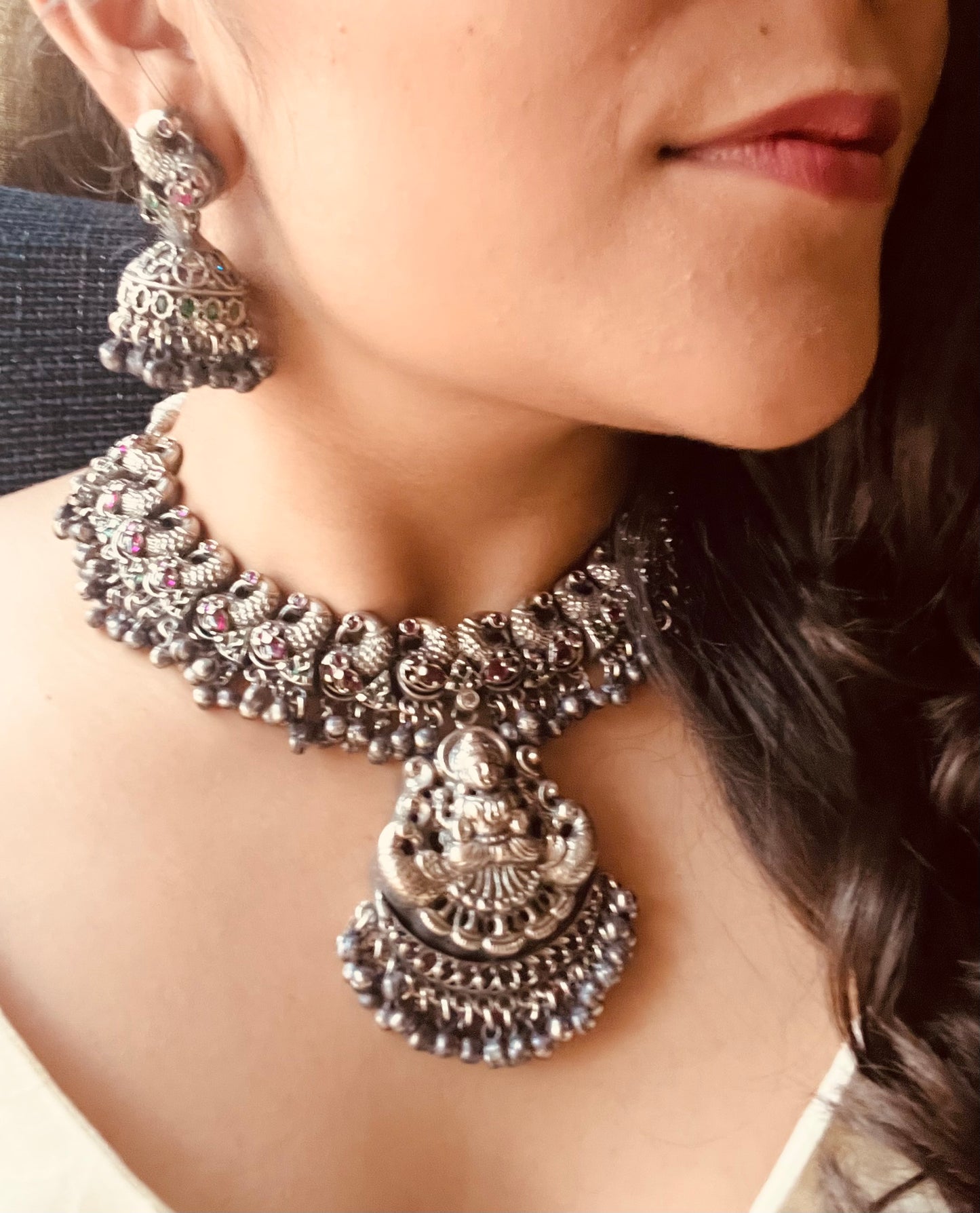 Silver finish temple jewelry set, peacock and Lakshmi design necklace, red stones inlay, matching jhumkas (earrings)