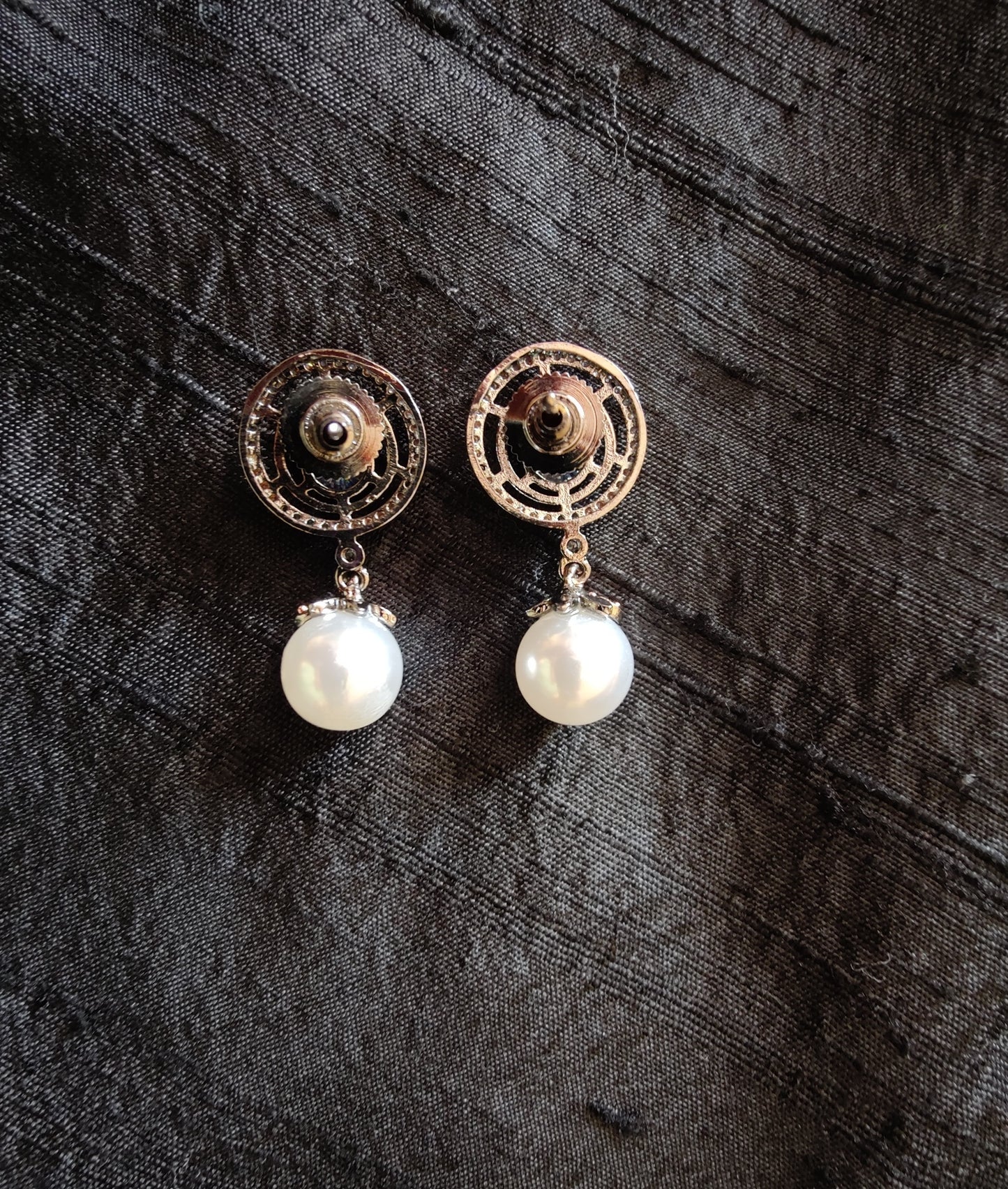 Dangling pearl and CZ stone earrings