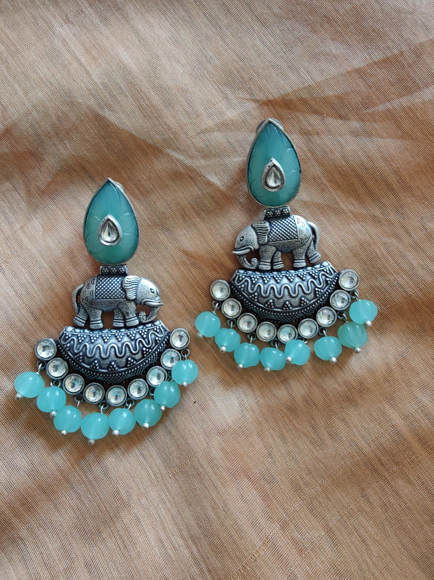 Statement earrings with elephant motif in silver finish
