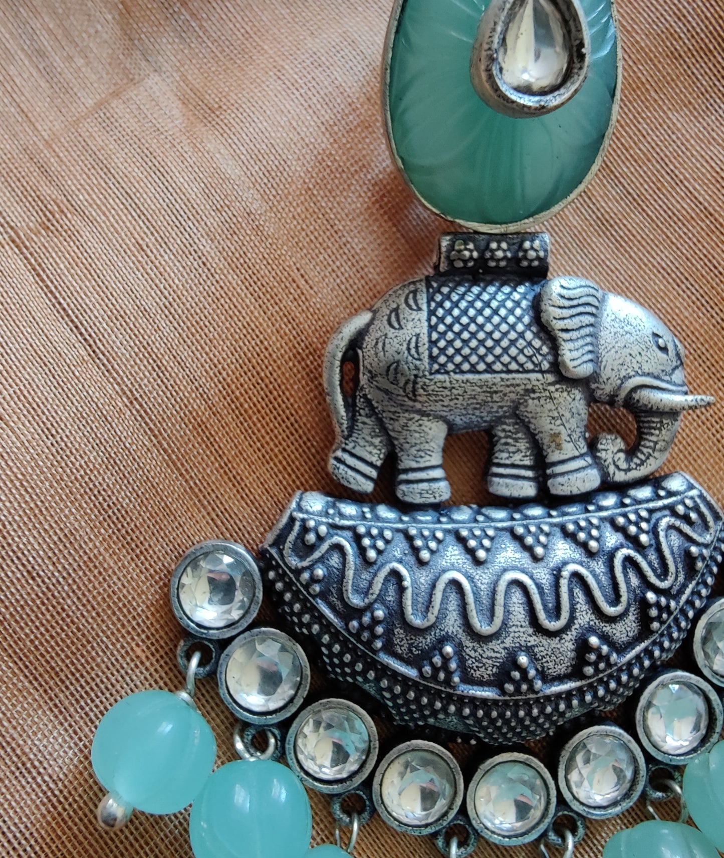 Statement earrings with elephant motif in silver finish