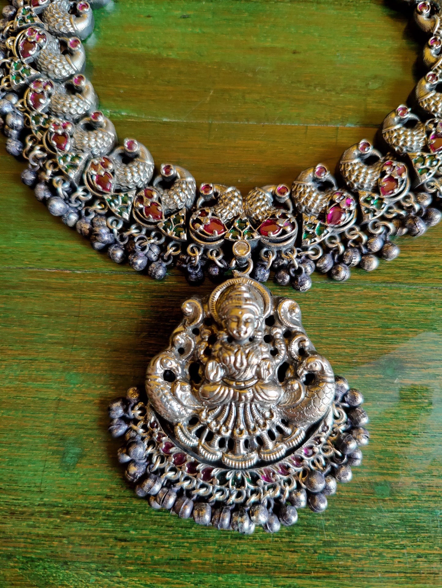 Silver finish temple jewelry set, peacock and Lakshmi design necklace, red stones inlay, matching jhumkas (earrings)