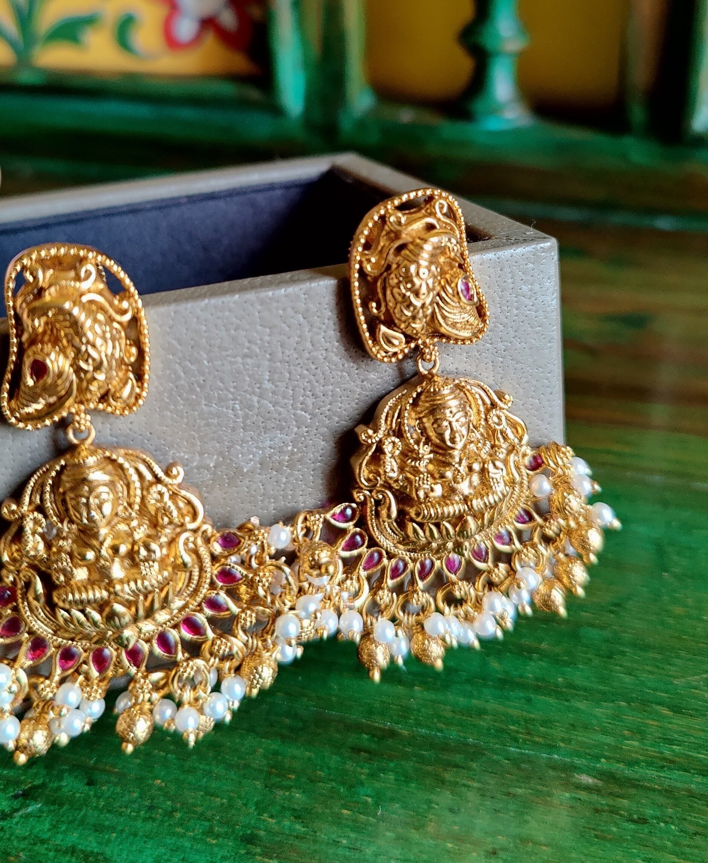 Temple jewelry set, choker style necklace with Goddess Lakshmi motif and red stones detailing, matching earrings