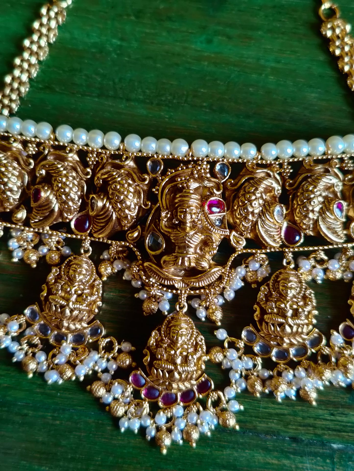 Temple jewelry set, choker style necklace with Goddess Lakshmi motif and red stones detailing, matching earrings