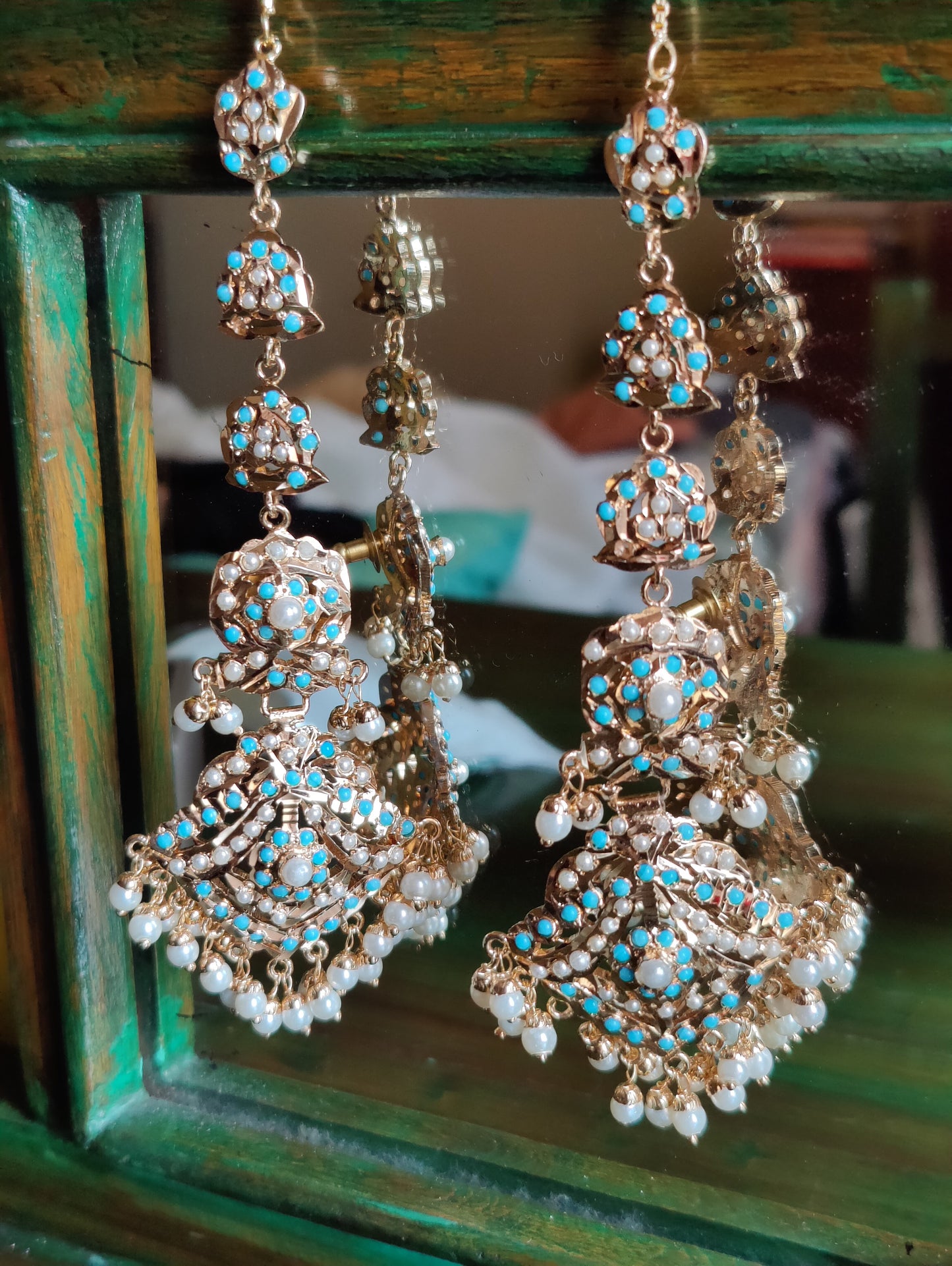 Jadau earrings with turquoise stone and pearl inlay