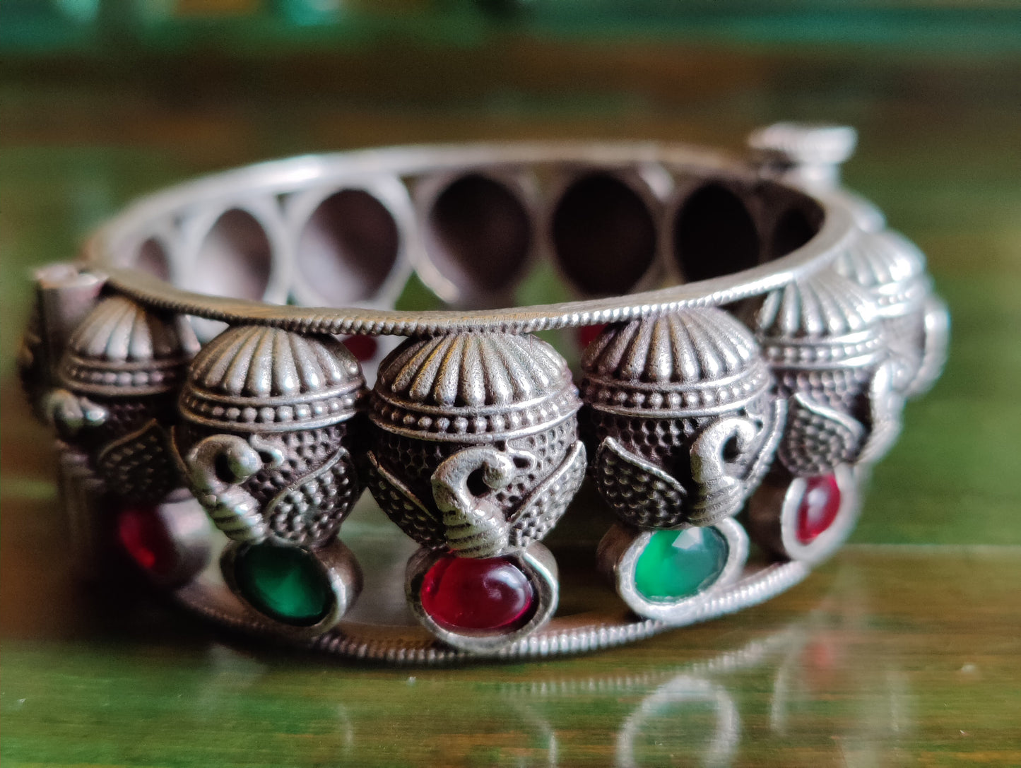 Silver finish bangle in peacock design, emerald and ruby stone work (1 pc)