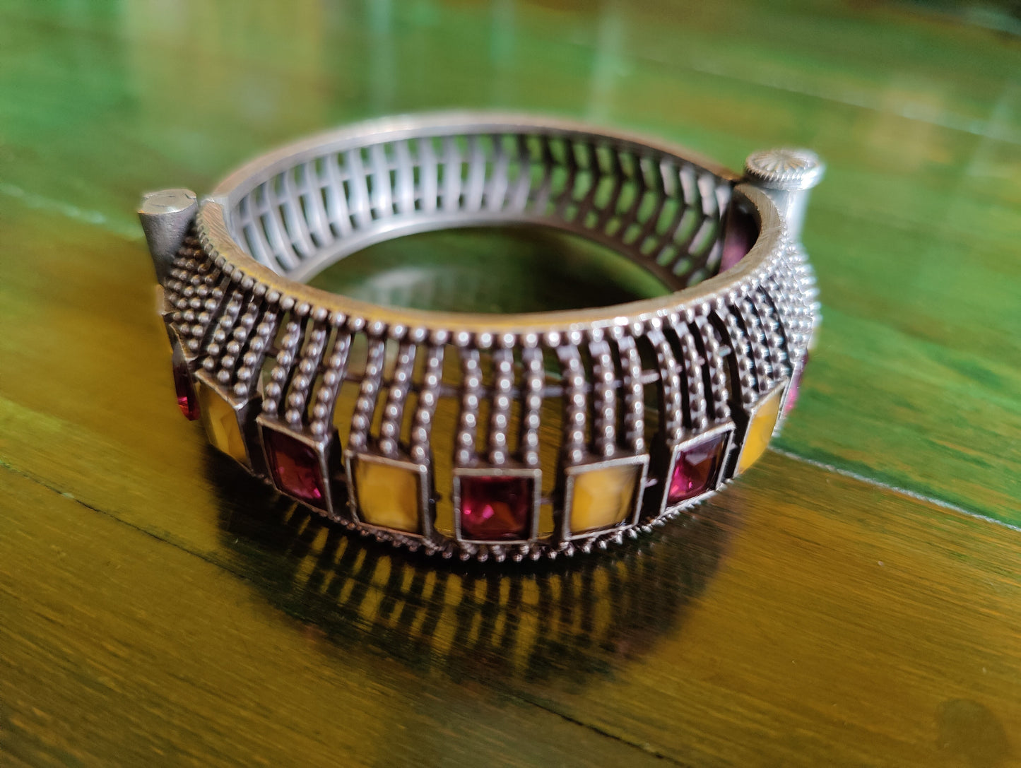 Silver finish broad bangle with sapphire-mint green/ruby-topaz stone work (bangle,1 pc)