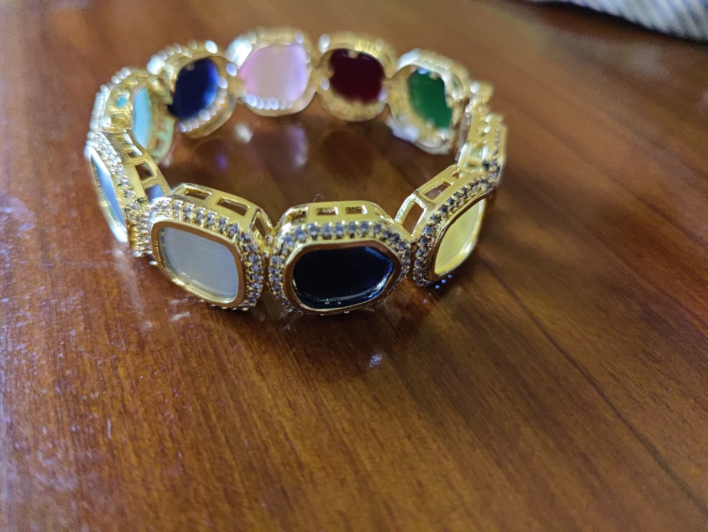 Bangle(Kara) with multicoloured big stones encircled by CZ , in gold finish (1 pc)