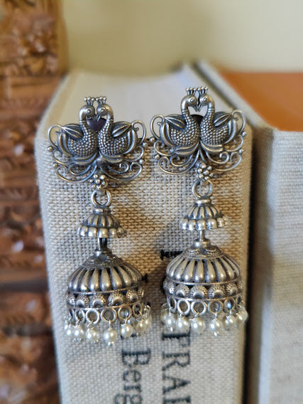 Silver peacock pair jhumkas (earrings) with pearls