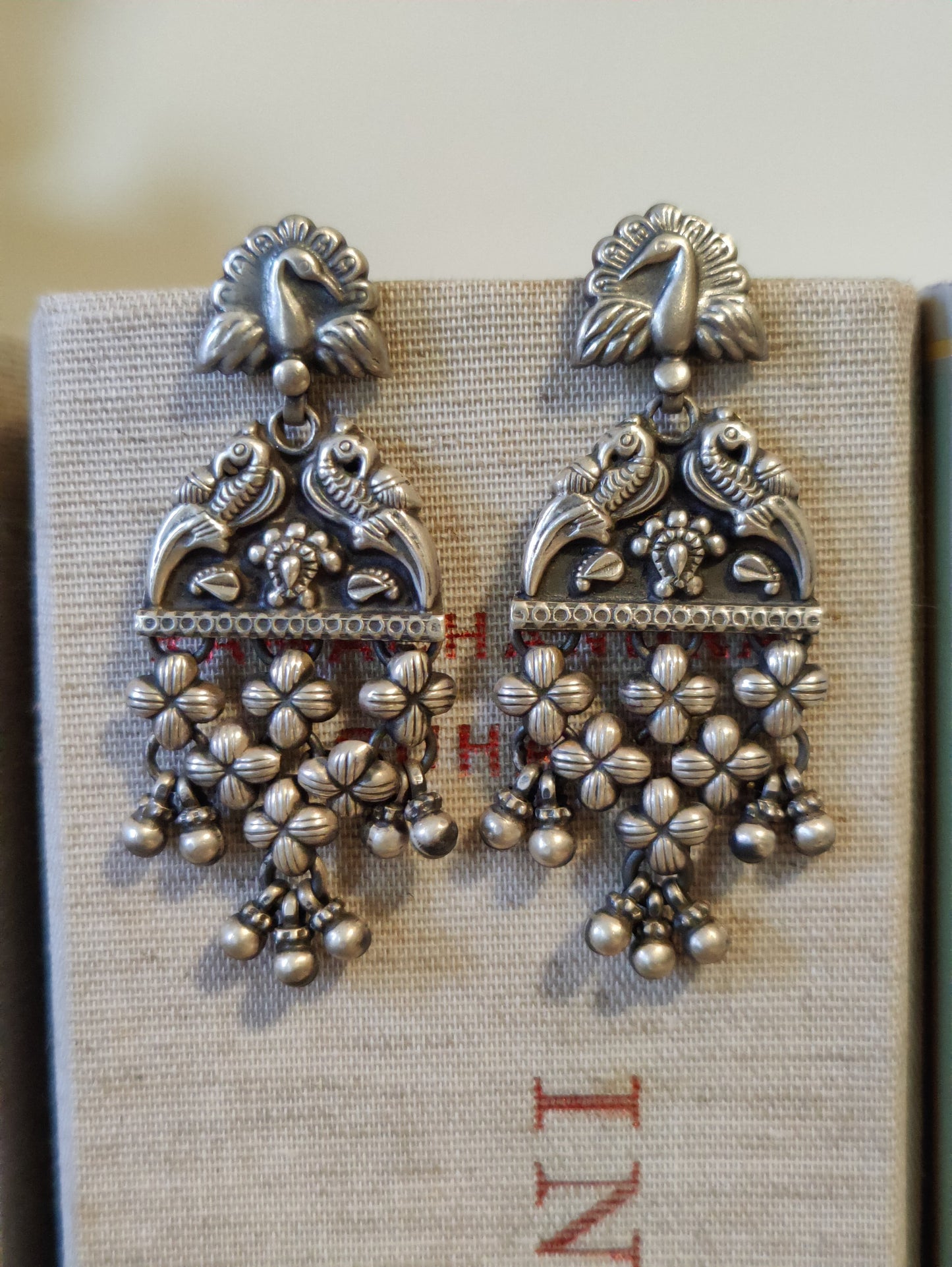 Silver earrings with peacock and chatai design with silver beads