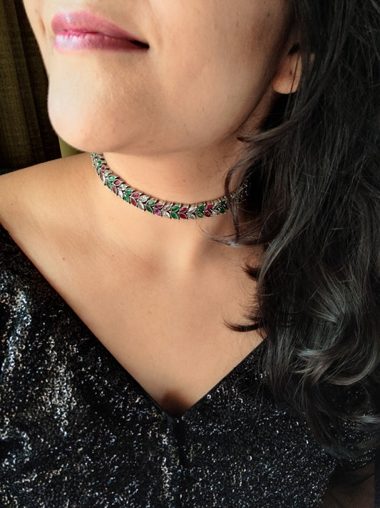 Silver finish sleek choker with red,green and clear stone leaf design