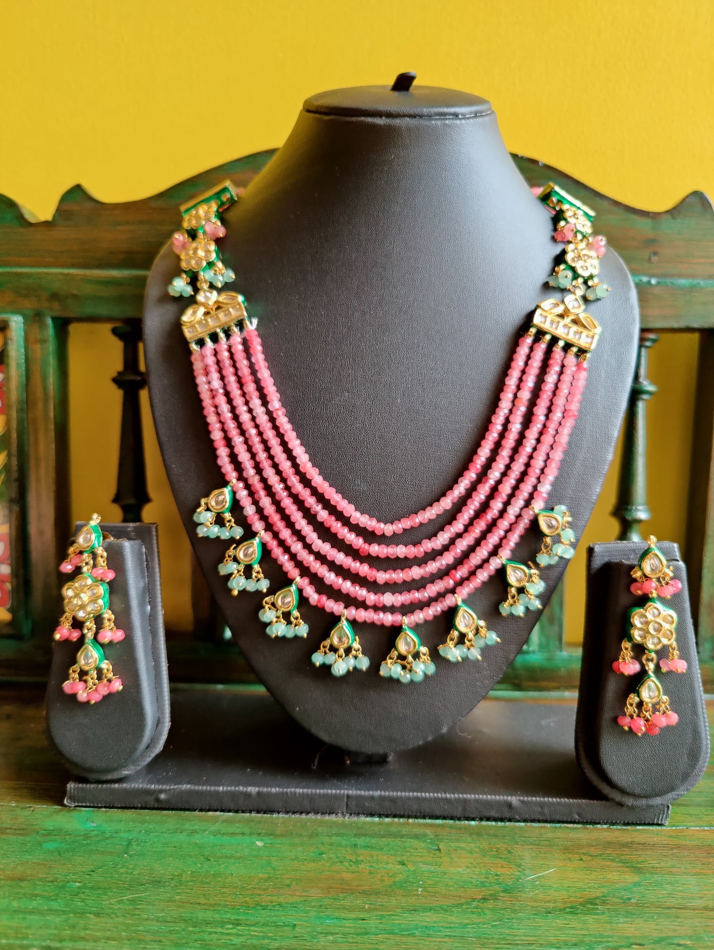 'Roseate' multi-strand necklace set in delicate pink beads and kundan, with matching earrings