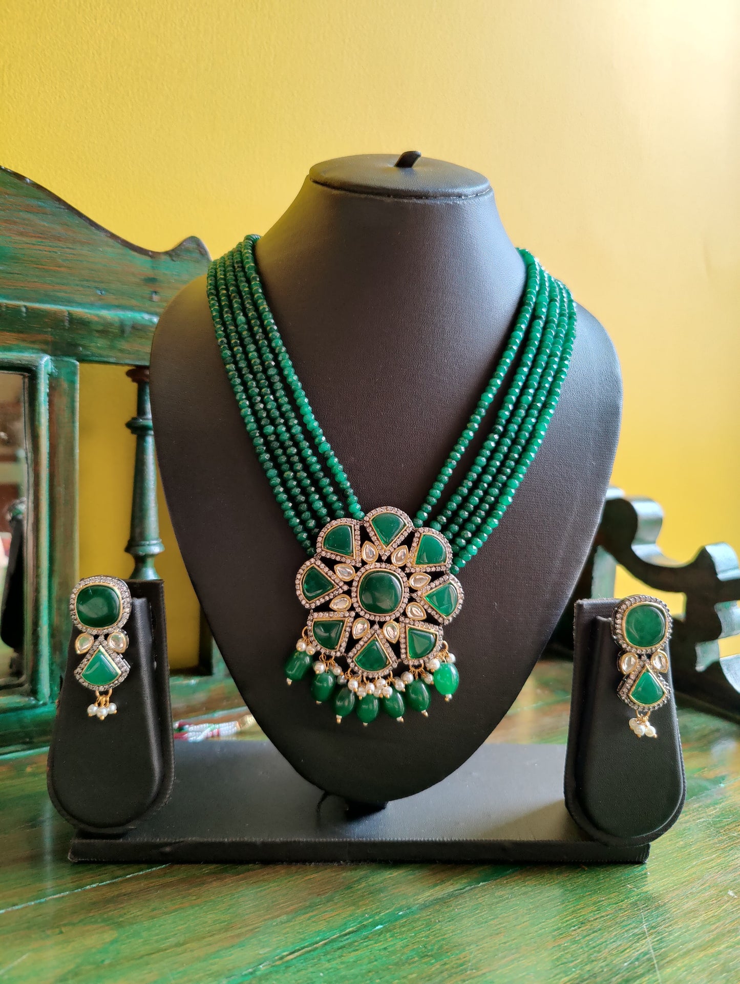 Long necklace set with big green stone and CZ flower pendant held with 5 layered stone beads, matching earrings