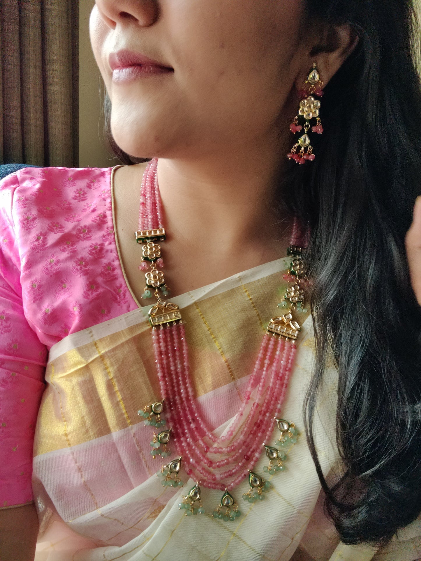 'Roseate' multi-strand necklace set in delicate pink beads and kundan, with matching earrings