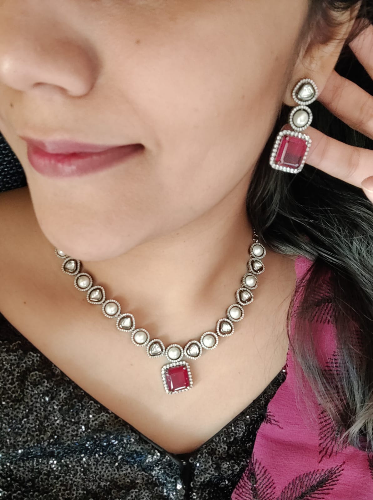 Antique silver finish set with square shaped ruby pendant on Kundan and pearl strand,matching earrings